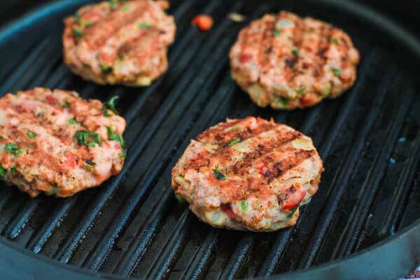 Place 2-4 patties in the pan at a time and cook for 3-4 minutes on each side.
